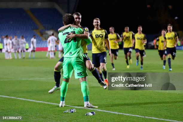 Eddie McGinty and Cameron Brannagan of Oxford United celebrate their sides victory in the Carabao Cup First Round match between Oxford United and...