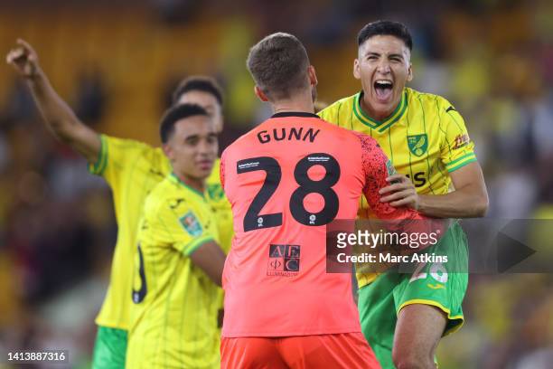 Marcelino Nunez celebrates with Angus Gunn of Norwich City after the penalty shootout during the Carabao Cup First Round match between Norwich City...