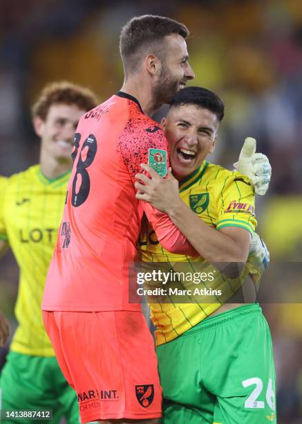 Marcelino Nunez celebrates with Angus Gunn of Norwich City after the penalty shootout during the Carabao Cup First Round match between Norwich City...