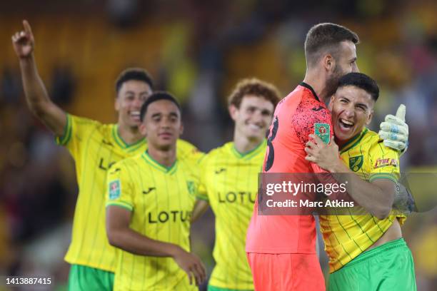 Marcelino Nunez celebrates with Angus Gunn of Norwich City after the penalty shootout during the Carabao Cup First Round match between Norwich City...