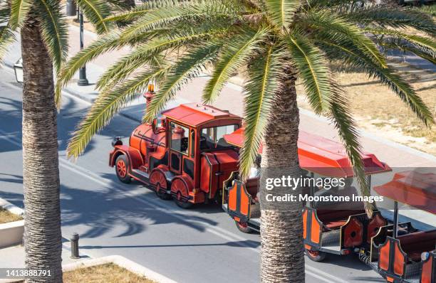 the little red train of rethymnon in crete, greece - crete rethymnon stock pictures, royalty-free photos & images