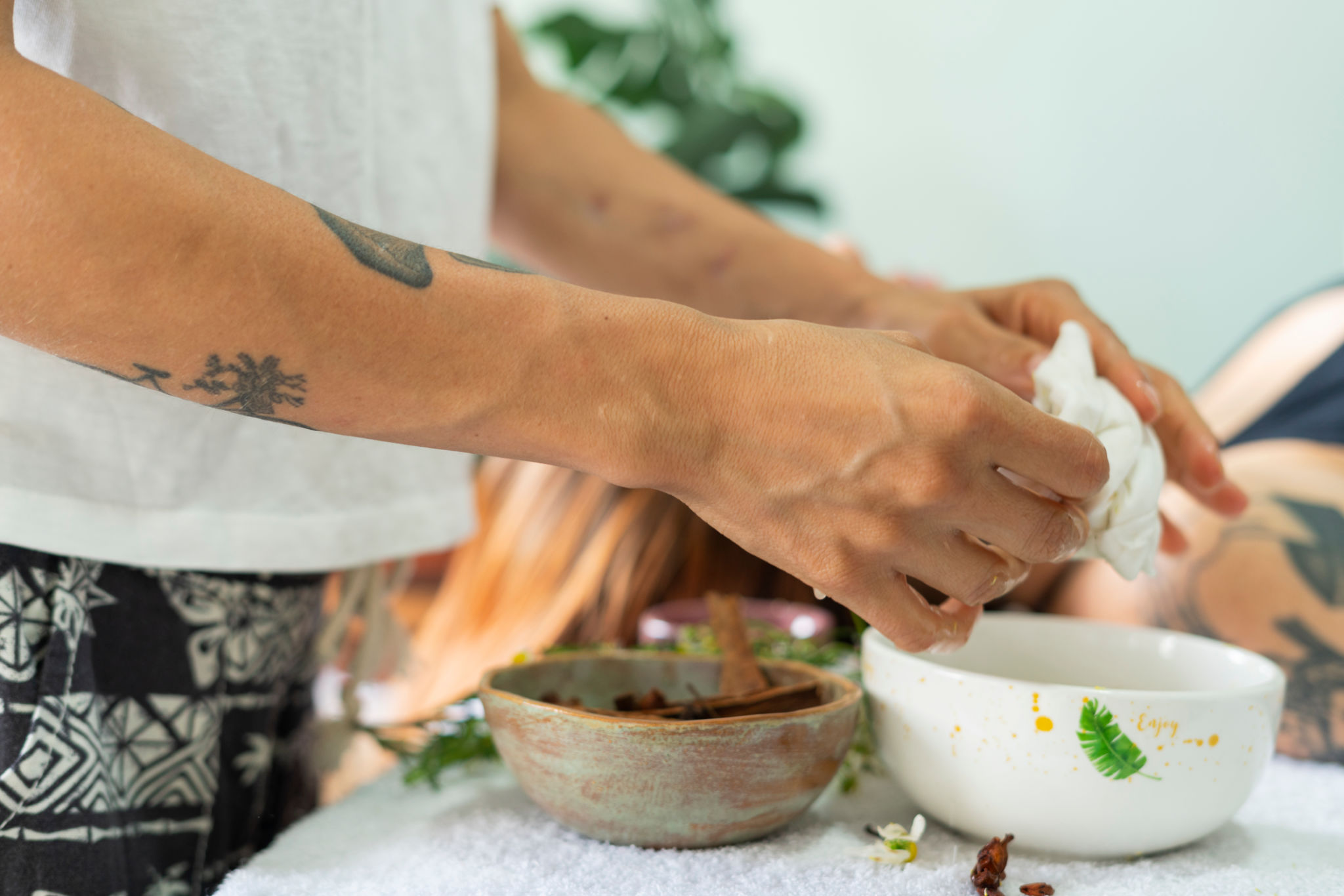 professional therapist woman performs easy massages with natural products to a client with her hands professional therapist woman performs easy massages with natural products to a client with her hands