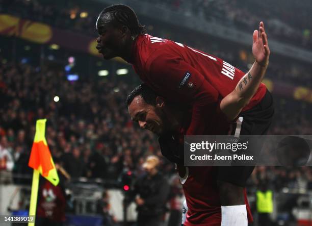 Sergio Pinto of Hannover celebrates with his team mate Didier Ya Konan after scoring his team's fourth goal during the UEFA Europa League second leg...