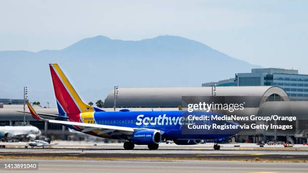 August 08: A Southwest jet departs at John Wayne Airport in Santa Ana, CA on Monday, August 8, 2022. Saddleback Mountain, part of the Santa Ana...