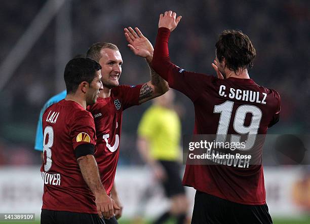 Konstantin Rausch of Hannover celebrate with his team mates after the UEFA Europa League second leg round of 16 match between Hannover 96 and...