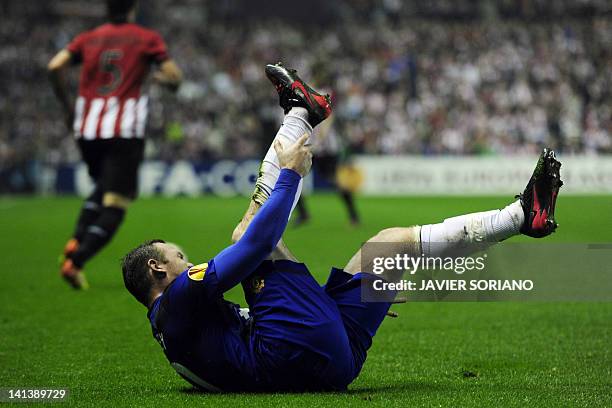 Manchester United's English forward Wayne Rooney gestures during the UEFA Europa round of 16 second leg football match Athletic Bilbao against...