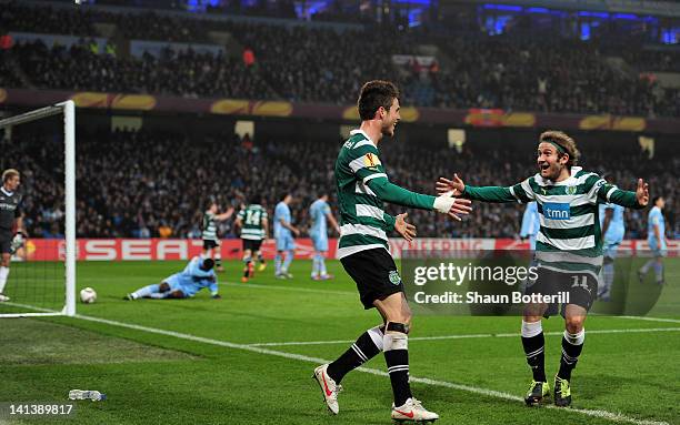 Diego Capel of Sporting Lisbon celebrates with goal scorer Ricky van Wolfswinkel of Sporting Lisbon after he scored their second goal during the UEFA...