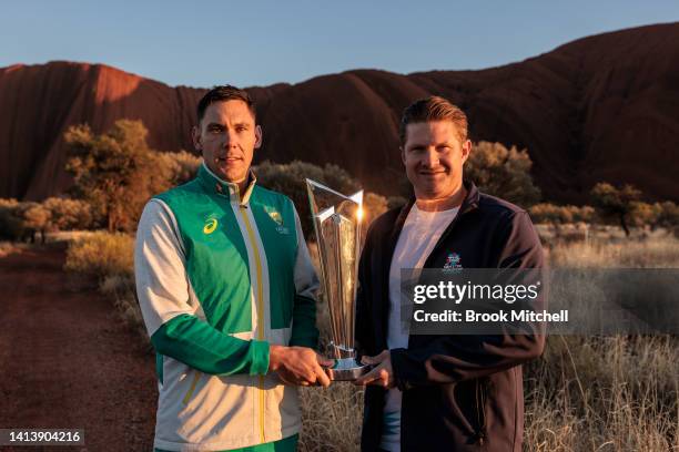 Scott Boland and Shane Watson pose with the ICC Men's T20 World Cup Trophy Tour at Uluru on August 09, 2022 in Uluru, Australia. The T20 World Cup...