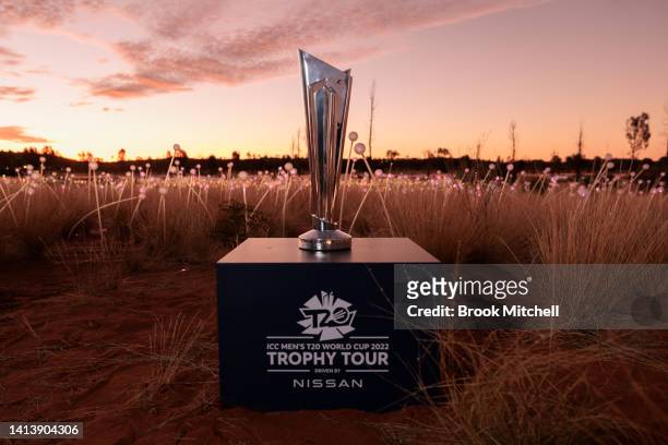 The T20 World Cup trophy is pictured in the field of light during the ICC Men's T20 World Cup Trophy Tour at Uluru on August 08, 2022 in Uluru,...