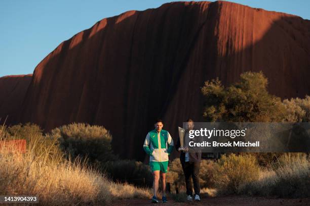 Scott Boland and Shane Watson pose with the ICC Men's T20 World Cup Trophy Tour at Uluru on August 09, 2022 in Uluru, Australia. The T20 World Cup...