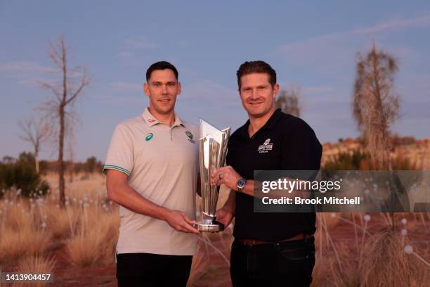 Scott Boland and Shane Watson pose with the ICC Men's T20 World Cup Trophy Tour at Uluru on August 08, 2022 in Uluru, Australia. The T20 World Cup...