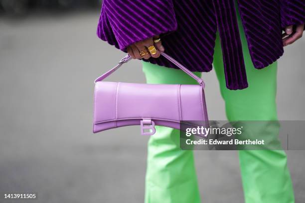Miki Cheung wears green a purple corduroy ribbed oversize blazer jacket, a pastel purple bag from Balenciaga, pastel green pants, outside Gestuz,...