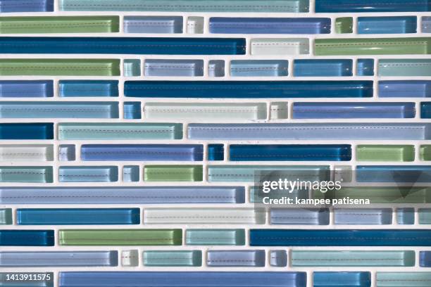 full frame shot of blue tiled wall - abundance tiles stock pictures, royalty-free photos & images