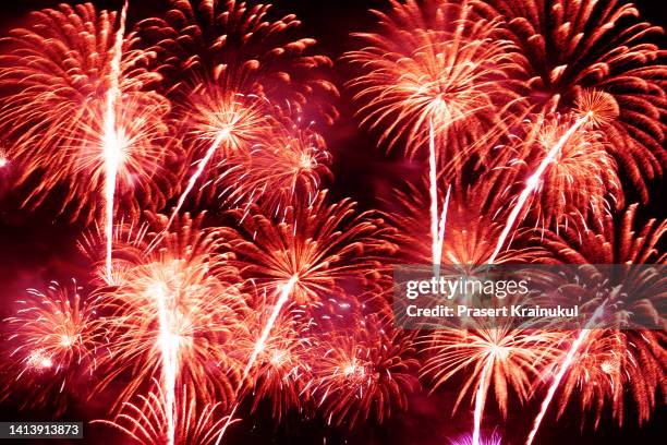 abstract red colored fireworks background - hua hin stock pictures, royalty-free photos & images