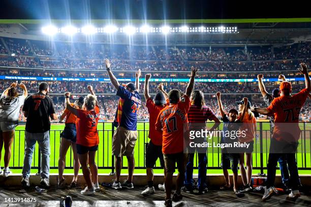 Houston Astros fans celebrate in center field after Aledmys Diaz hits a grand slam in the fourth inning against the Texas Rangers at Minute Maid Park...