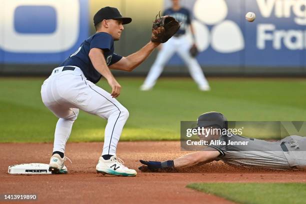 Andrew Benintendi of the New York Yankees steals second base against Adam Frazier of the Seattle Mariners in the first inning at T-Mobile Park on...