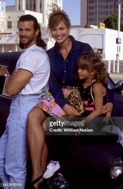 American actor Lorenzo Lamas, wife, American actress Kathleen Kinmont and daughter Shayne Lamas, pose for a portrait on the set of adventure and...