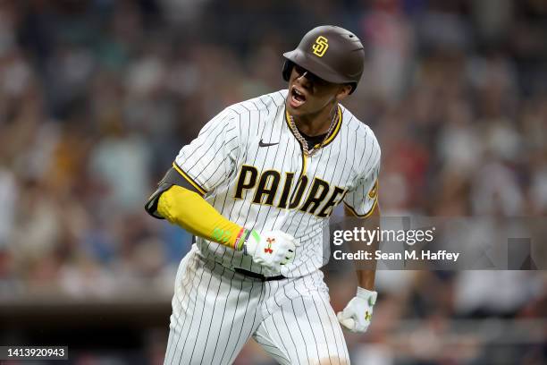 Juan Soto of the San Diego Padres reacts after hitting a solo homerun during the fourth inning of a game against the San Francisco Giants at PETCO...