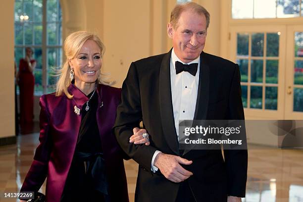 James "Jim" Crown, president of Henry Crown and Co., and Paula Hannaway arrive to a state dinner hosted by U.S. President Barack Obama and first lady...