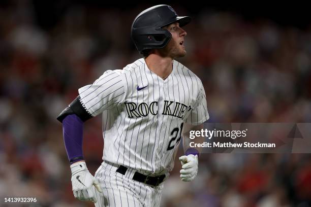 Ryan McMahon of the Colorado Rockies circles the bases after hitting a two RBI home run against the St Louis Cardinals in the seventh inning at Coors...