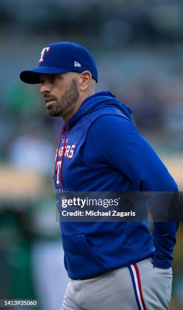 Manager Chris Woodward of the Texas Rangers on the field during the game against the Oakland Athletics at RingCentral Coliseum on July 22, 2022 in...