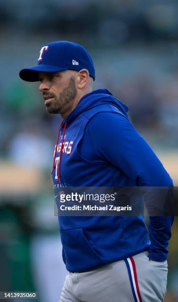 Manager Chris Woodward of the Texas Rangers on the field during the game against the Oakland Athletics at RingCentral Coliseum on July 22, 2022 in...