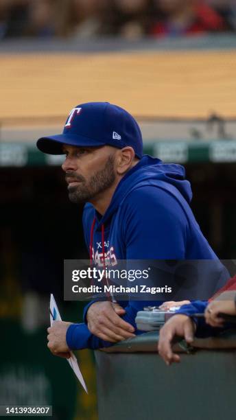 Manager Chris Woodward of the Texas Rangers in the dugout during the game against the Oakland Athletics at RingCentral Coliseum on July 22, 2022 in...