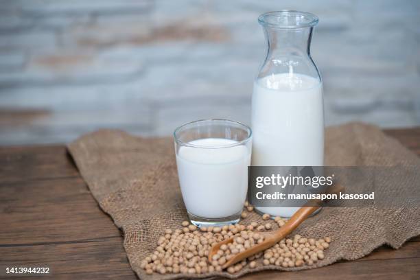 soy milk on the table. - sojamilch stock-fotos und bilder