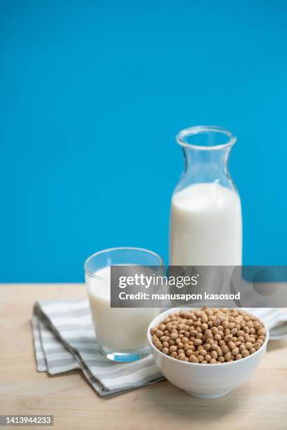 soy milk on the table. - sojamilch stock-fotos und bilder