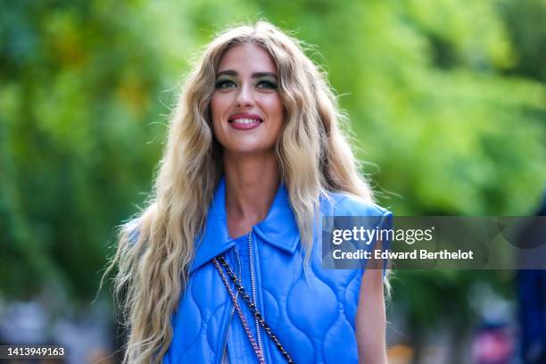 Emili Sindlev wears a royal blue quilted / sleeveless / oversized zipper gilet, outside A. Roege Hove, during Copenhagen Fashion Week Spring/Summer...