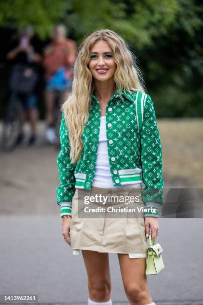 Emili Sindlev wearing green Louis Vuitton jacket, beige skirt, Prada gauntlets in white seen outside The Garment during Copenhagen Fashion Week...