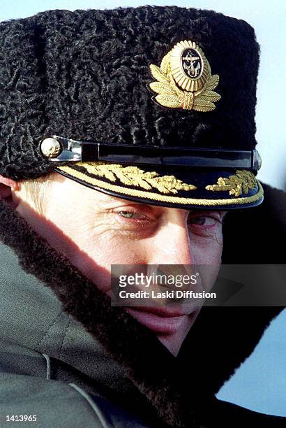 Russian President Vladimir Putin wears a navy cap during a visit near Severomorsk, where naval exercises took place on April 6, 2000.