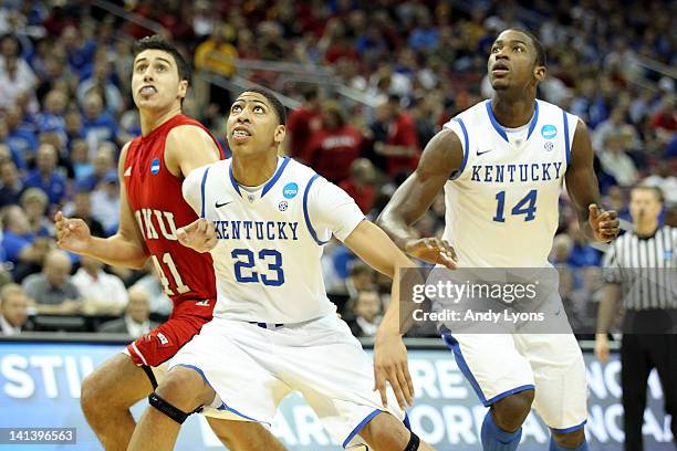 Anthony Davis and Michael Kidd-Gilchrist of the Kentucky Wildcats position themselves for a rebound in the first half against Vinny Zollo of the...