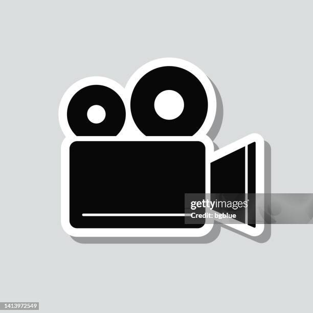 movie camera. icon sticker on gray background - producer icon stock illustrations