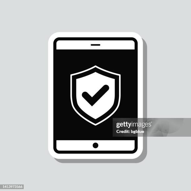 secure tablet pc. icon sticker on gray background - quality control approved stock illustrations