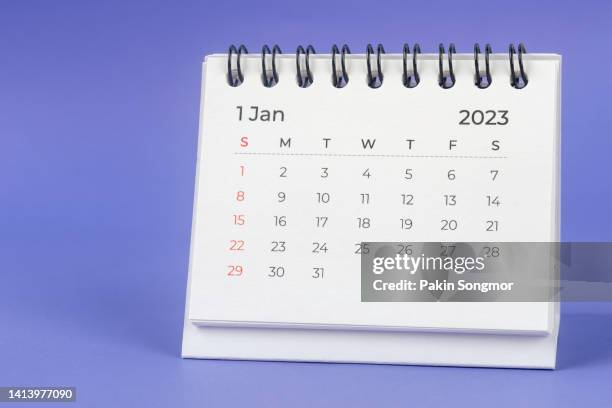 calendar desk 2023 january is the month for the organizer to plan and deadline with a blue background. - tischkalender stock-fotos und bilder