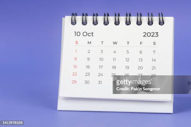 calendar desk 2023 october is the month for the organizer to plan and deadline with a blue background. - oktober stockfoto's en -beelden