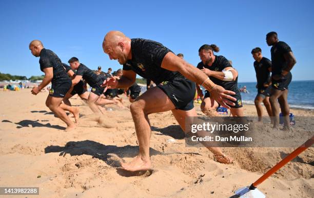 Jack Yeandle of Exeter Chiefs sprints during a beach training session at Exmouth Beach on August 09, 2022 in Exmouth, England.