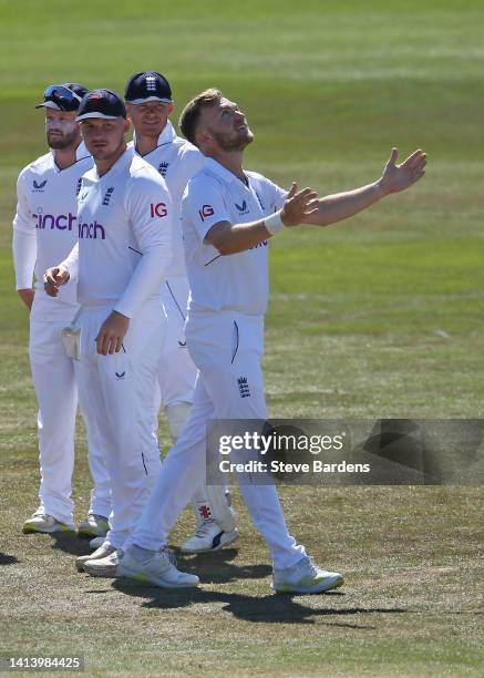 Sam Cook of England Lions celebrates taking the wicket of Khaya Zondo of South Africa during day two of the tour match between England Lions and...