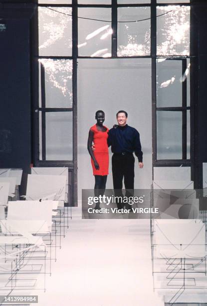 Alek Wek and fashion designer Issey Miyake walks the runway during the Issey Miyake Ready to Wear Spring/Summer 1999 fashion show during Paris...