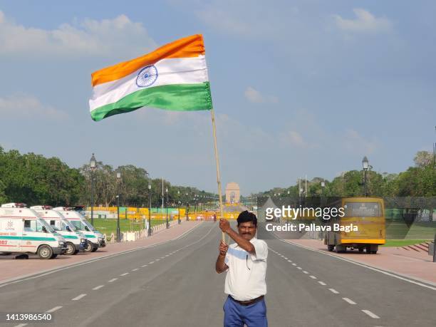 The Indian flag is waved by a citizen in celebration of the 75th year of Indian Independence from the British rule on August 9, 2022 in New Delhi,...