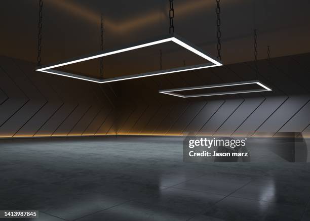 a dark room under the light - show room photos et images de collection