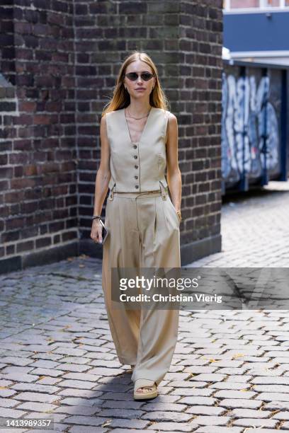 Pernille Teisbaek seen wearing beige vest, pants outside A. Roege Hove during Copenhagen Fashion Week Spring/Summer 2023 on August 09, 2022 in...
