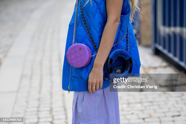 Emili Sindlev is seen wearing blue puffer vest, Chanel bag in purple, wide leg pants, sandals outside A. Roege Hove during Copenhagen Fashion Week...