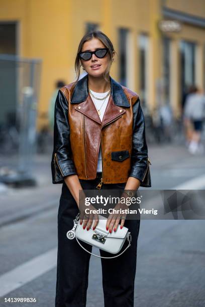 Darja Barannik seen wearing Louis Vuitton bag and brown black jacket, denim jeans outside A. Roege Hove during Copenhagen Fashion Week Spring/Summer...