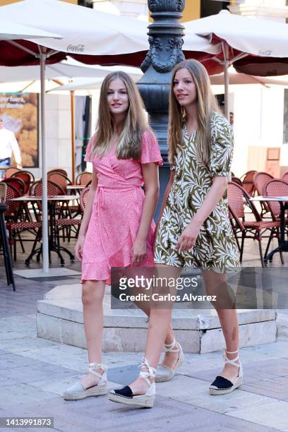 Crown Princess Leonor of Spain and Princess Sofia of Spain are seen walking through the city center during their vacations on August 10, 2022 in...