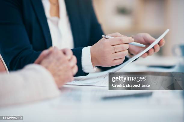 hands closeup on contact, legal settlement or financial report while reading and making notes. lawyer team doing work and analyzing documents. lawyers looking through client finance data together - contract stockfoto's en -beelden