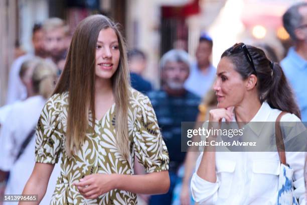 Princess Sofia of Spain and Queen Letizia of Spain are seen walking through the city center during their vacations on August 10, 2022 in Palma de...