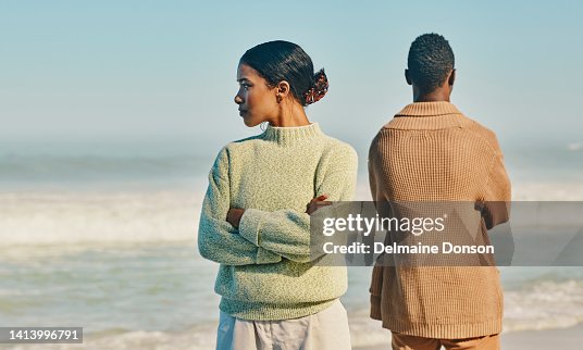 Couple, relationship and marriage problems while traveling together and spending time at the beach. Upset, unhappy and angry man and woman ignoring each other after a fight, arguing or quarrel Couple, relationship and marriage problems while traveling together and spending time at the beach. Upset, unhappy and angry man and woman ignoring each other after a fight, arguing or quarrel