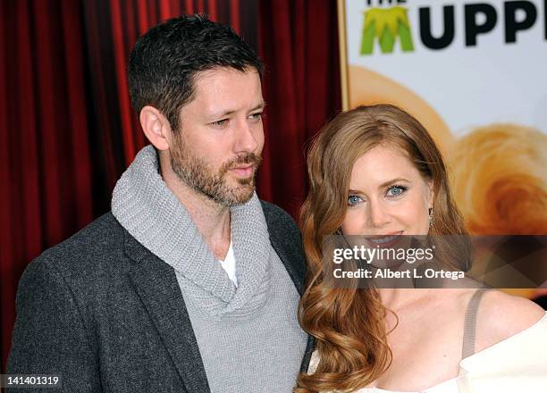 Actor Darren Le Gallo and actress Amy Adams arrive for "The Muppet" Los Angeles Premiere held at the El Capitan Theatre on November 12, 2011 in...